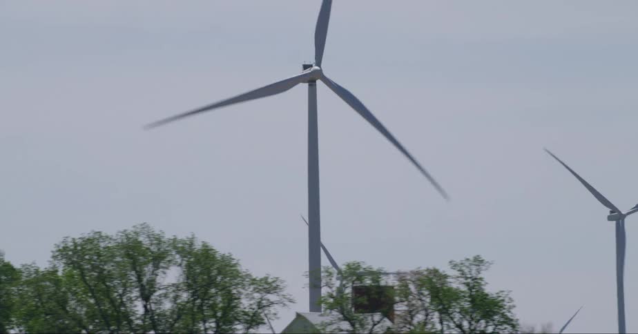 Wind turbines on wind farm against the sky