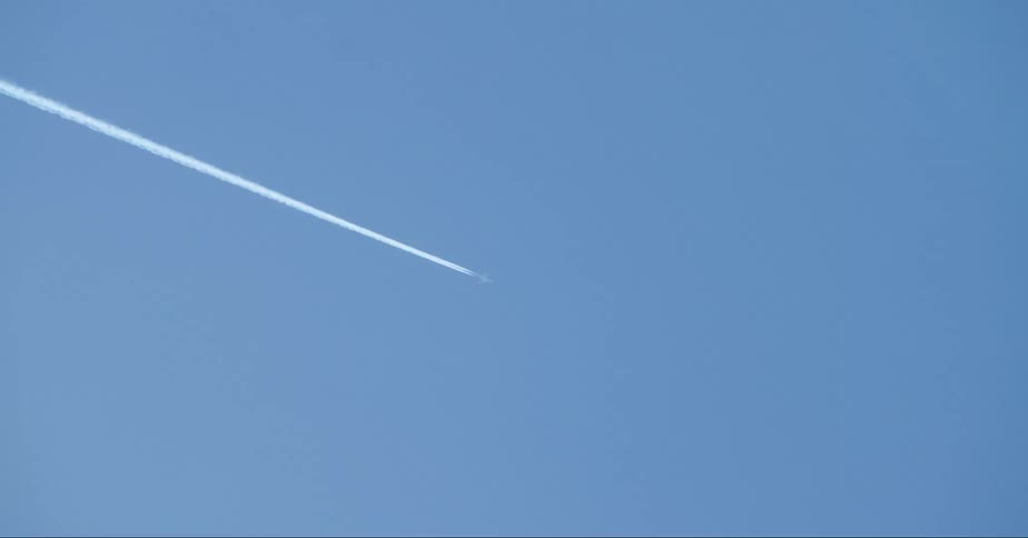 Jet trails in the sky at midday
