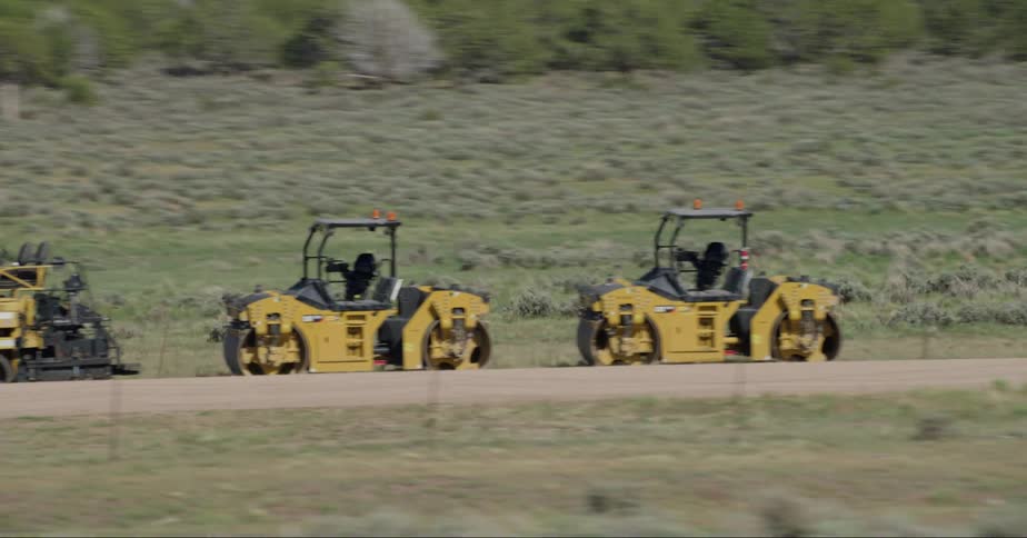 Tractors on a vast land mass