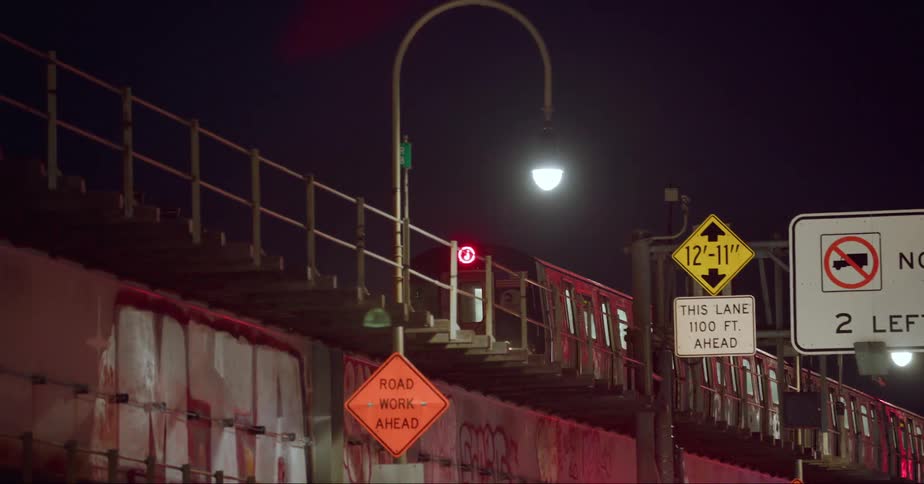 A train passes over a bridge in an urban city