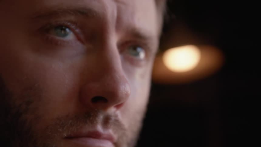 Closeup of a mans face with blue eyes