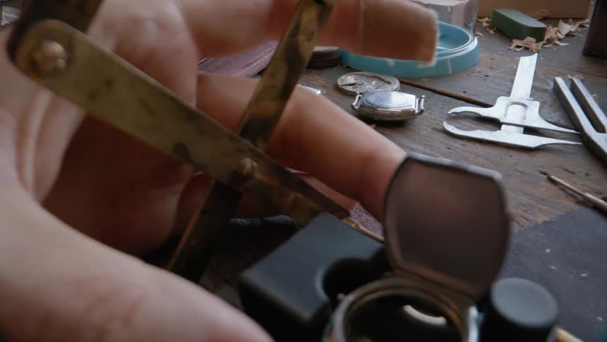 A person is repairing a watch