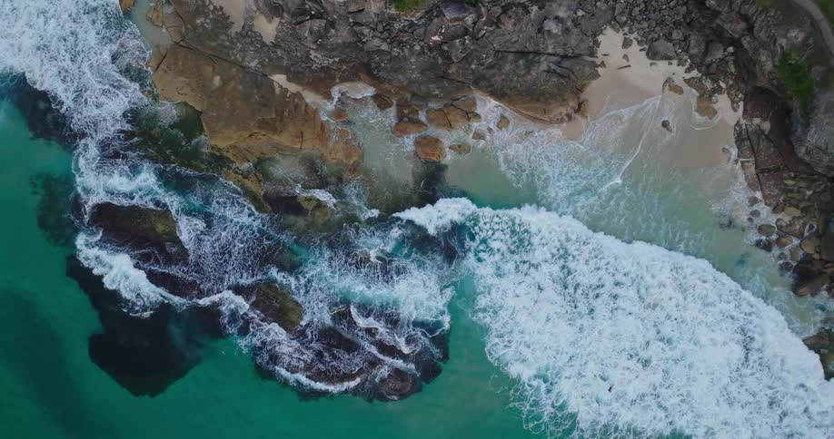 Aerial of sea waves at midday