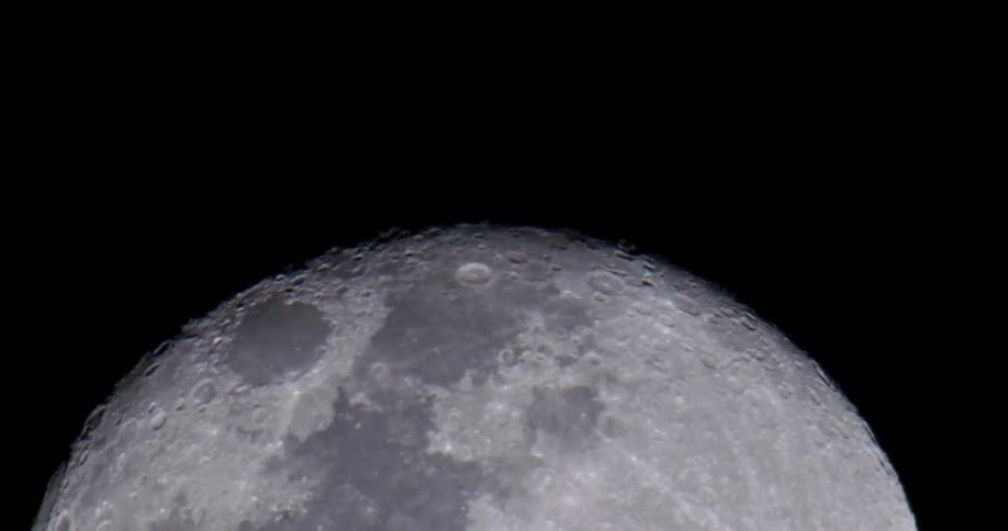 The moon is very close as it reveals itself in space