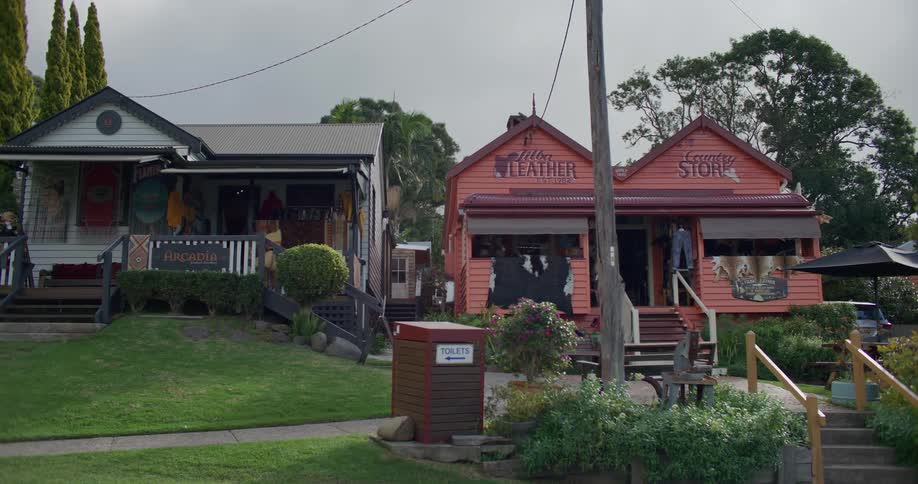 Two small stores shaped like conventional houses