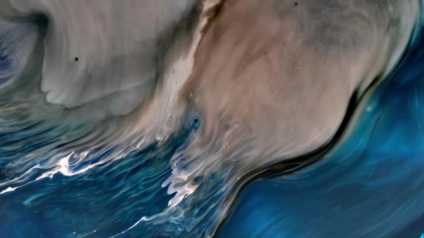 Blue sea with gentle waves and foam
