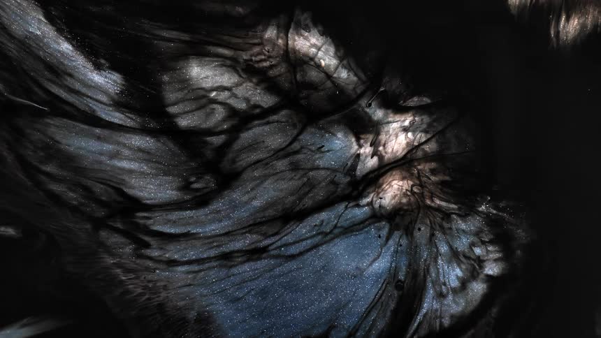 Strands of dark material bloating a blue shimmering background