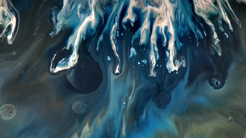 Aerial of the sea with gentle waves and foam