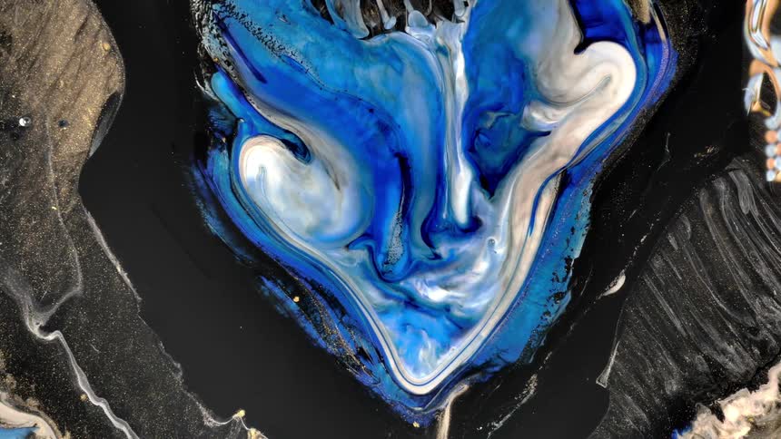 A small ink wave of blue colors is covering a black ink
