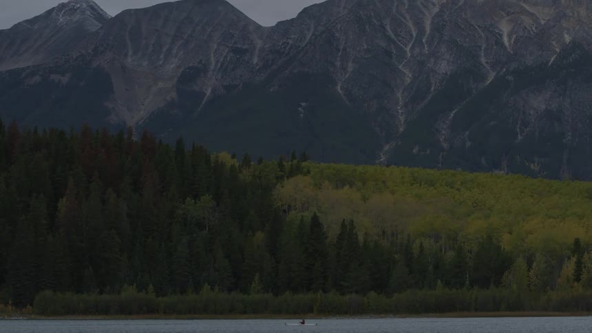 A boat floating on a mountain lake
