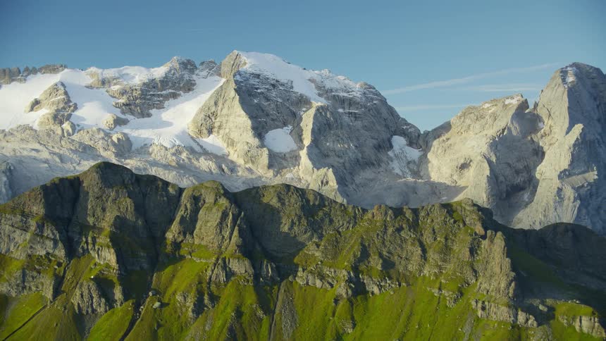Marmolada glacier covered with snow and others with vegetation