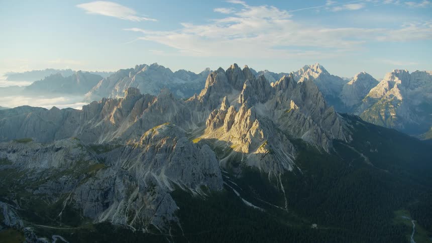 Aerial of a wild landscape surrounded by mountains and forests