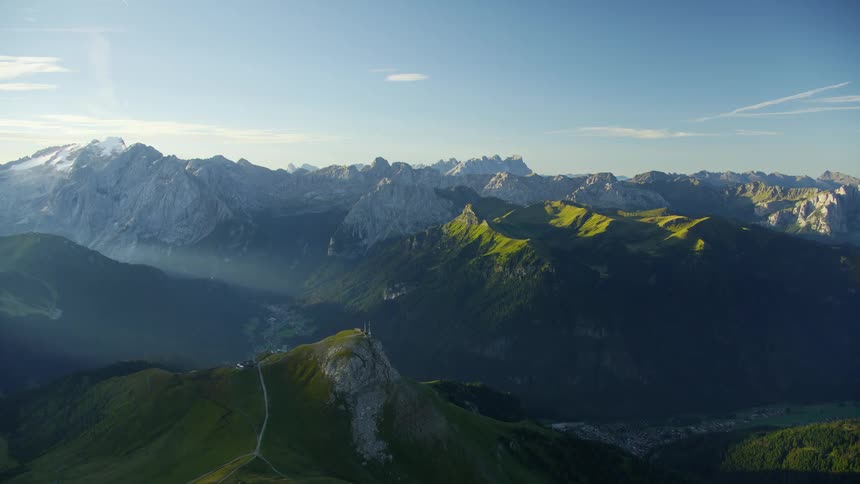 An aerial view of a rocky mountain range with geological formations