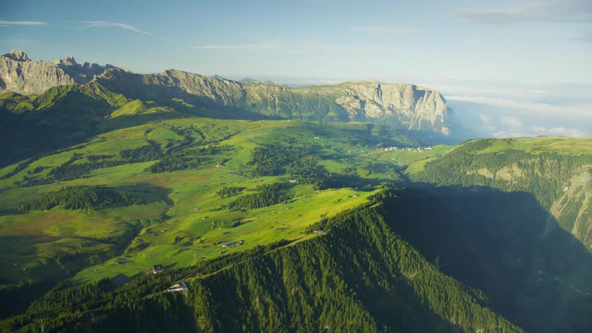 Aerial view of a mountain range above the cloud level