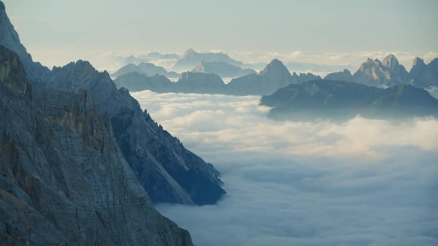 A high region with stone mountains whose peak rises above the level of the clouds