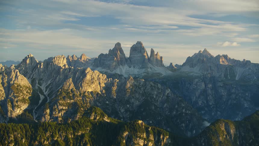 Landscape of mountains with rocky peaks and geological formations at dawn