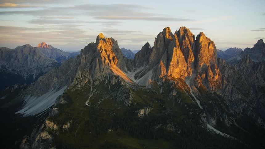 The rough dolomite mountains with jagged peaks stand high above the valley below