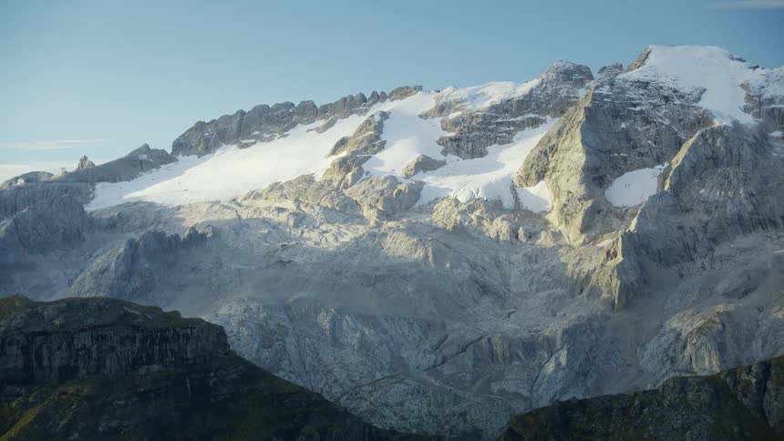 Aerial view of the snowcovered slopes of a mountain at morning