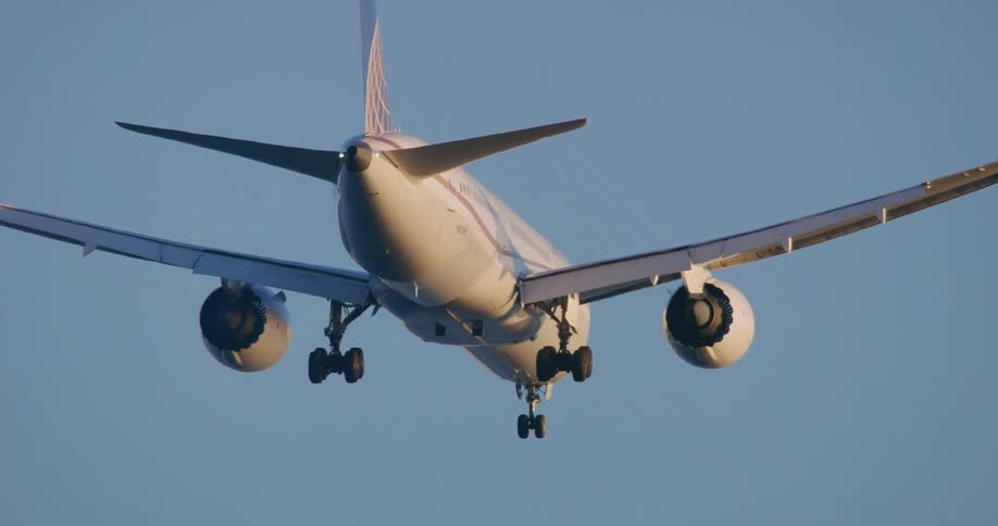 A huge commercial plane flying in a blue sky