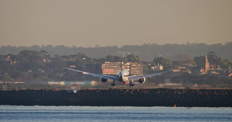 Airplane landing at the seaside airport
