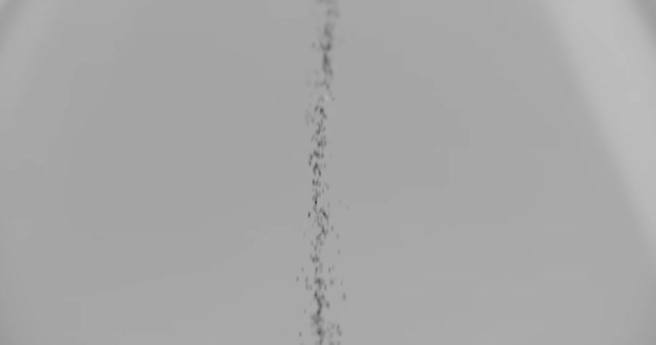 An hourglass where grains of sand are falling into the compartment below