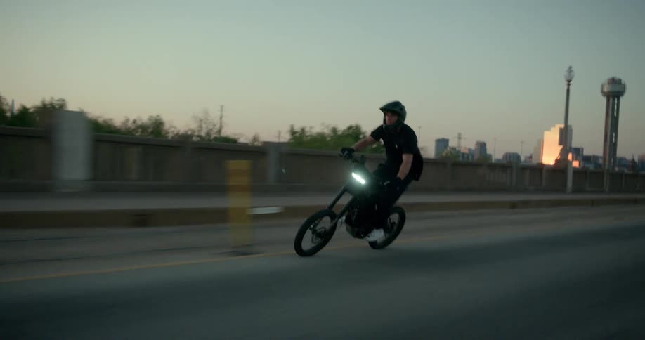 A video of a man riding a bike
