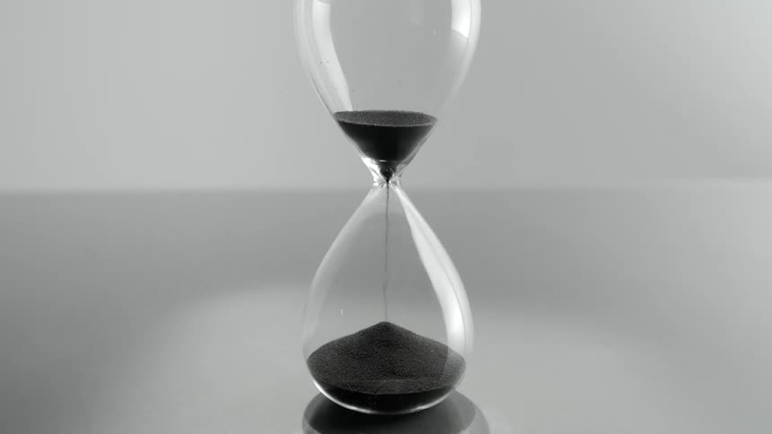 Falling sand grains in an hourglass