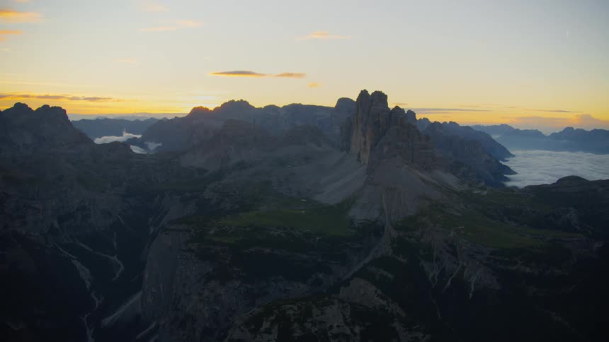 The sun is rising on the mountains