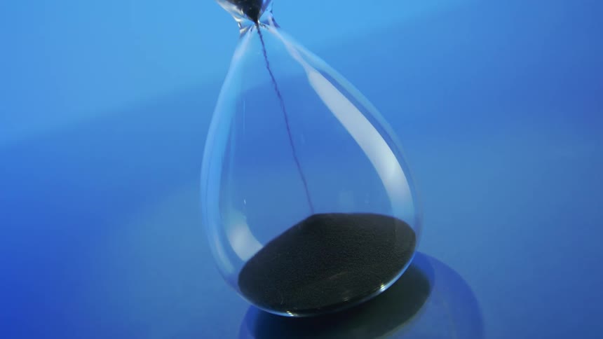 An hourglass in a blue room
