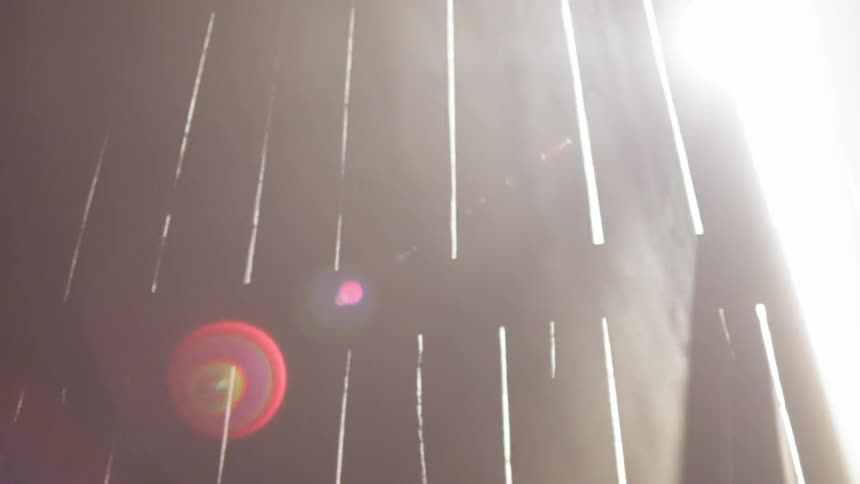 Sun is peeking in through the boards of this wall