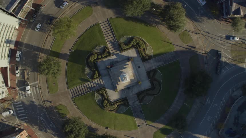 Cars drive around the roundabout