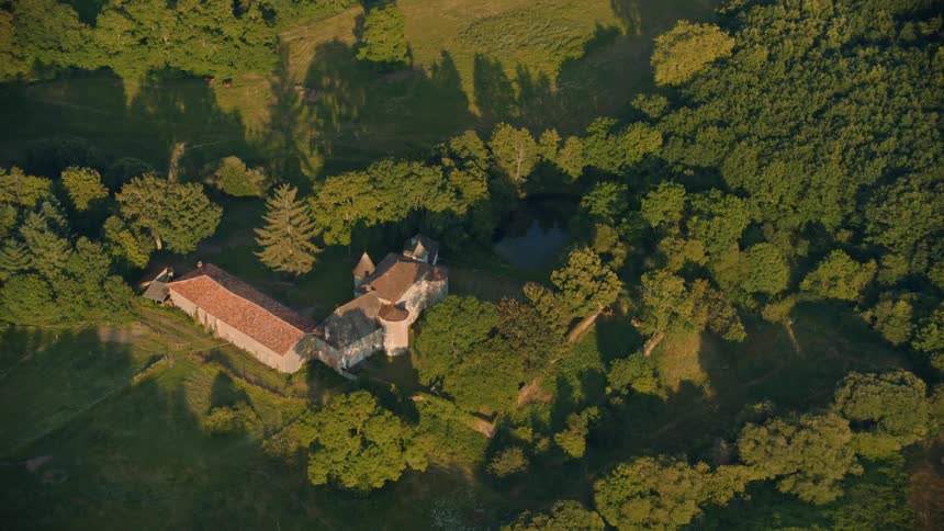 Aerial of the castle in the countryside during the day