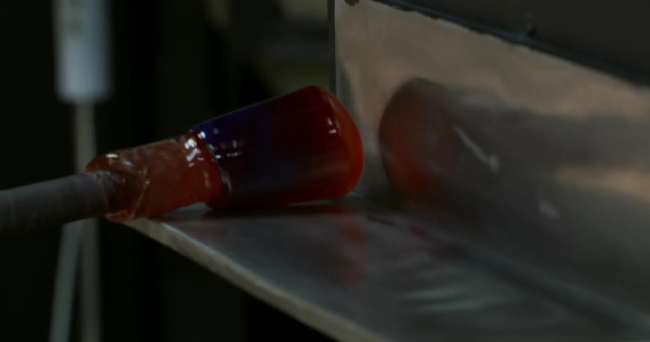 A glassblower and glassshaping instrument in motion