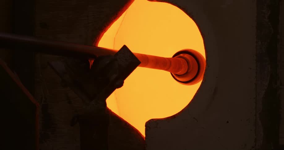 A lamp in a dark room shining an orange light