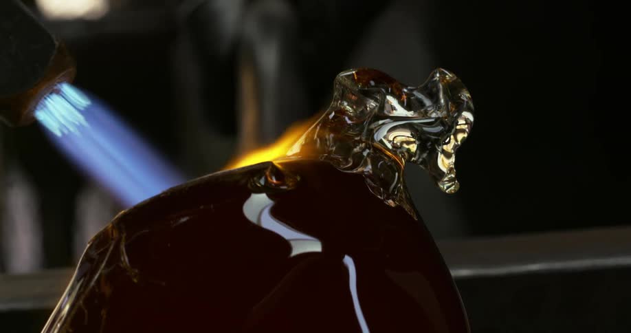 Hot blue flame is used to melt an alloy metal to form certain shape