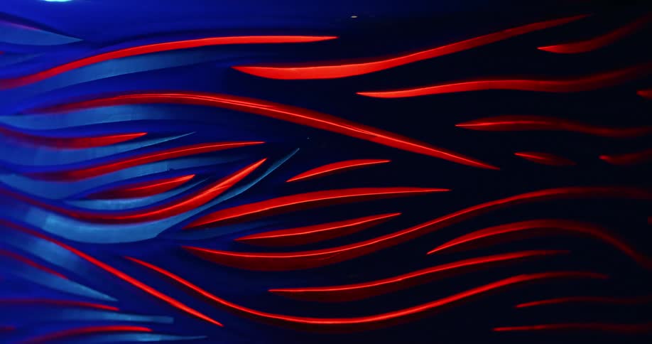 Series of red lines light up with a blue light slowly covering them