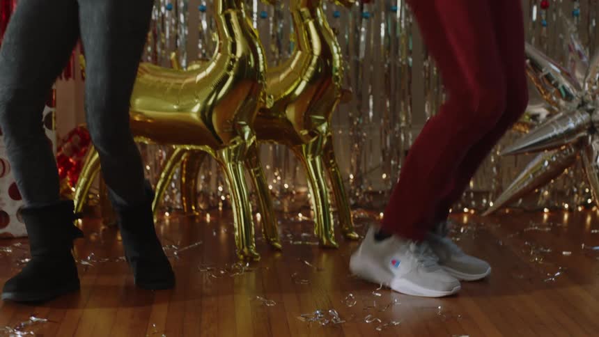 Dancers perform routine near christmas decorations