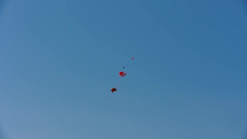 Person skydiving through the sky outdoors during day time