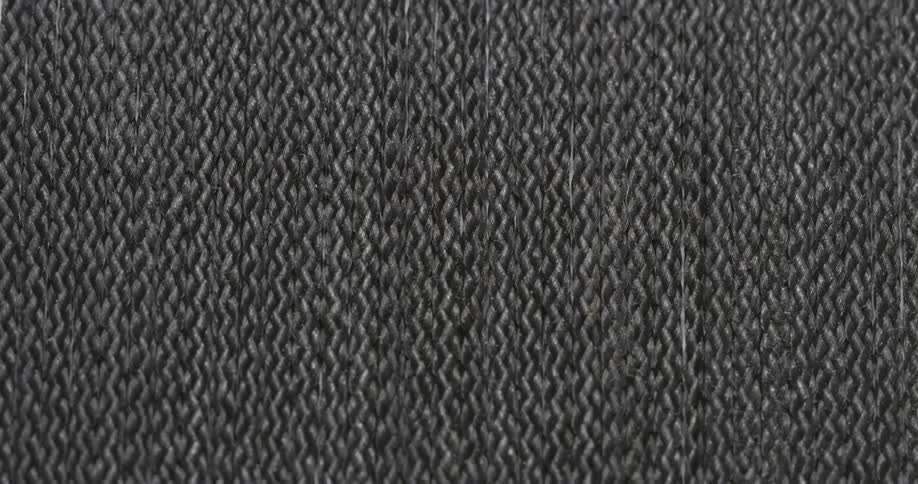 Light shines between rows of fabric as the light brightens
