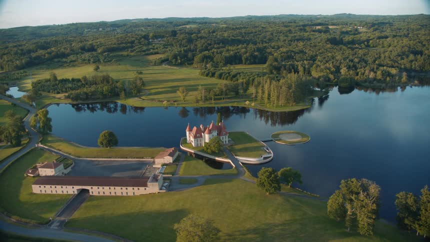 Aerial view of castle on islet in lake