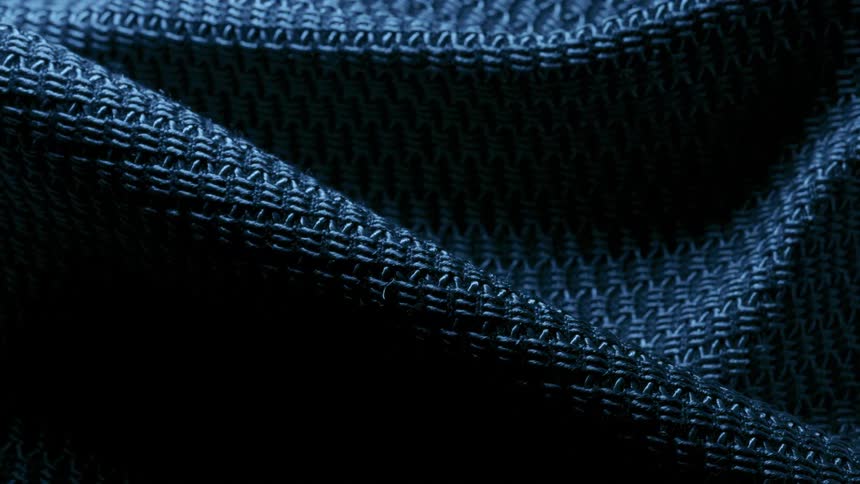 Lights and shadows over a blue textured cloth