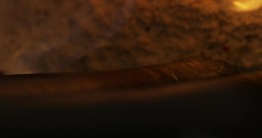 Flames rising from the bottom of a furnace
