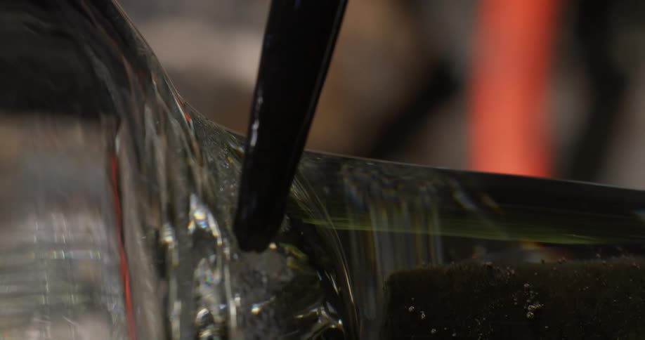 Liquid dropping and flowing to the right