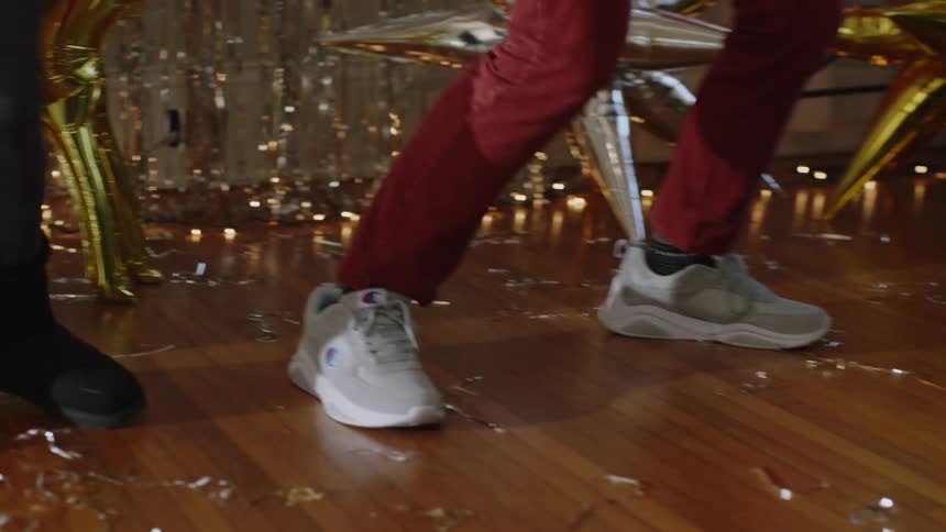 Legs of a couple dancing a choreography in a party