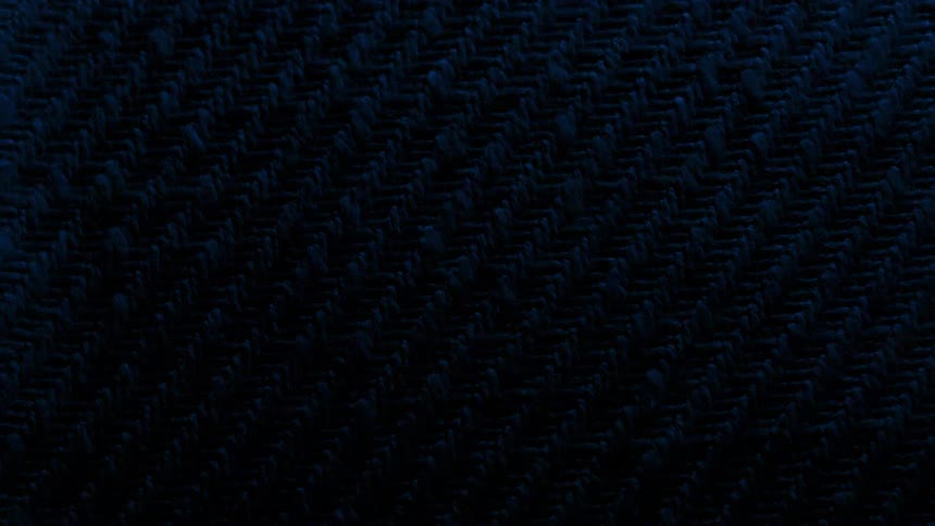 A blue rug with rough surface and a light flicking