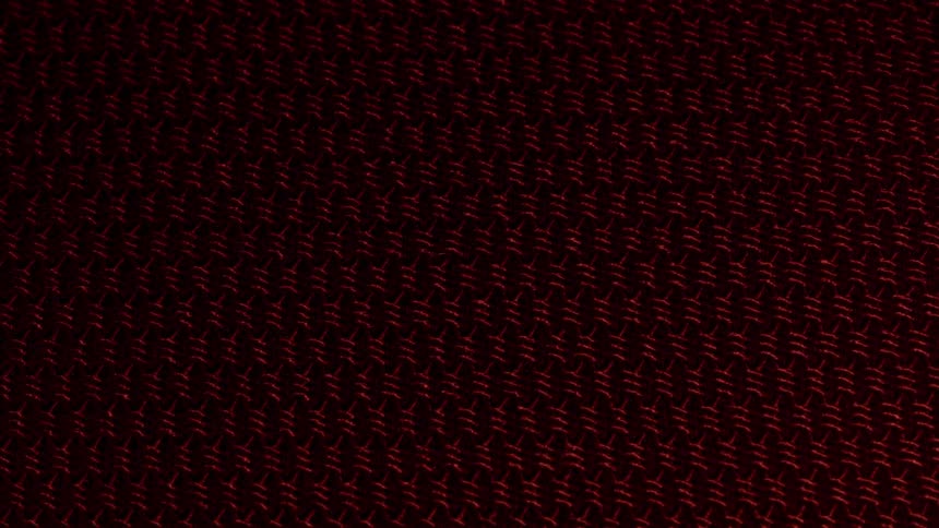A pattern of red objects being illuminated by light