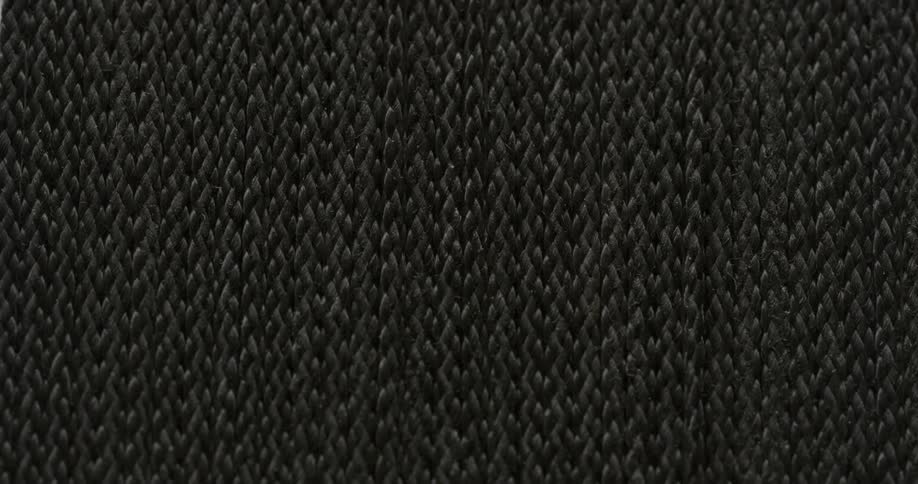 Low light increasing brightness on aswatch of motionless dark gray woven wool fabric