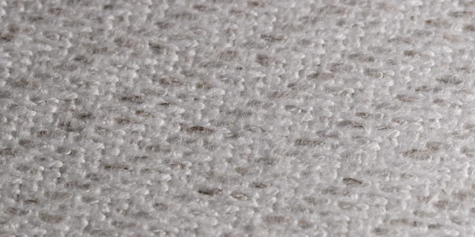 Light and shadows over a white woven cloth