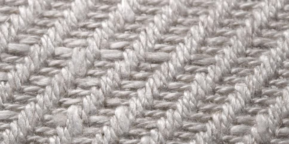 Close up of light and shadow on the surface of a piece of woven fabric