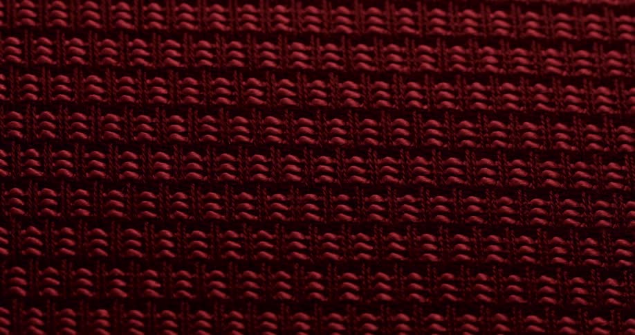 A texture with red patterns fading into the darkness